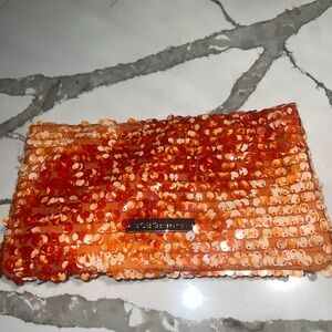 BCBG extendable clutch purse